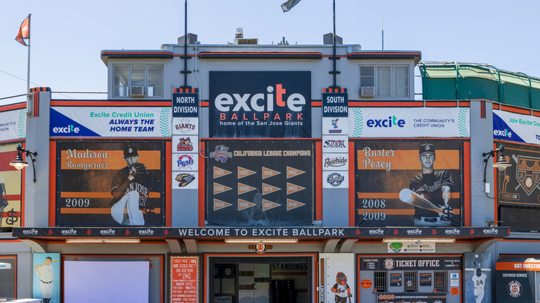 Exterior view of historic Excite Ballpark in San Jose, California, with view of retro-style murals featuring Madison Baumgartner, Buster Posey, and more