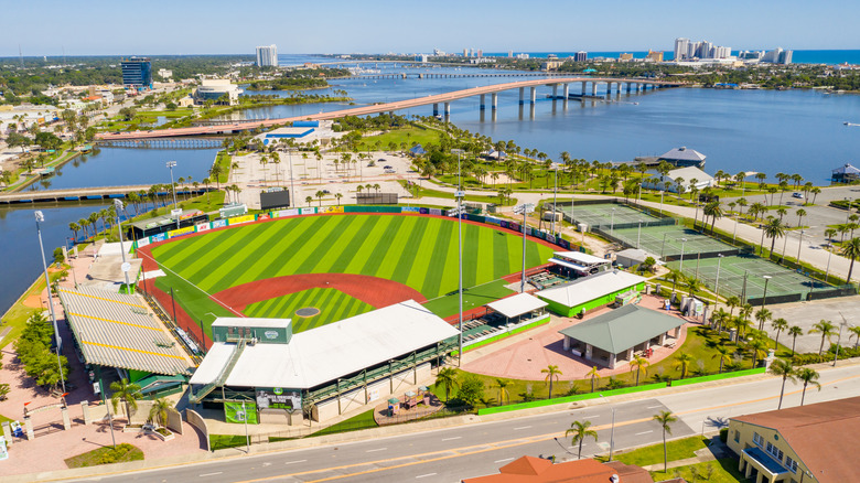 Aerial drone photo of Jackie Robinson Memorial Baseball Park with historic field and blue water visible on a bright, sunny day