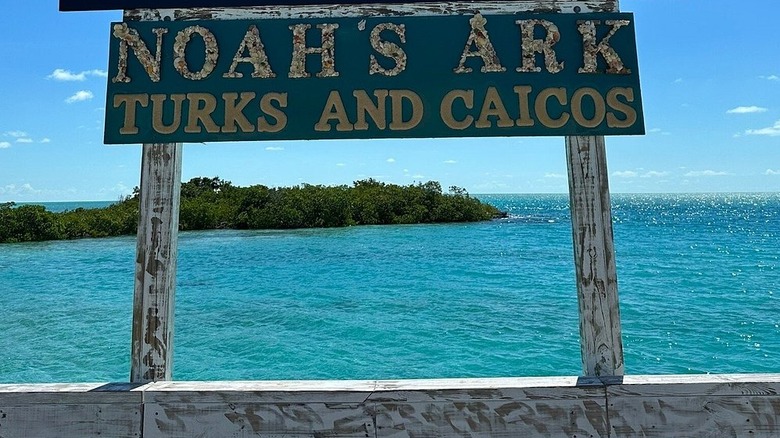 Sign for Noah's Ark Beach Club overlooking the ocean