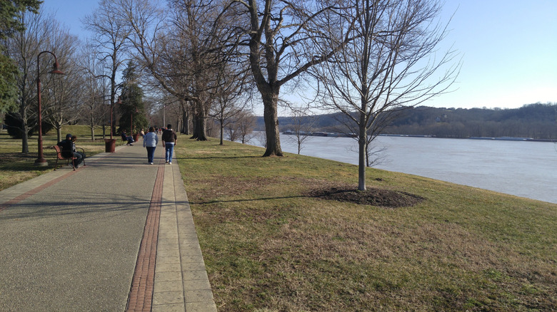A trail along the Ohio River with people walking