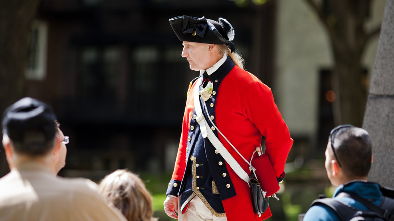 A costumed guide taking visitors along the Freedom Trail in Boston