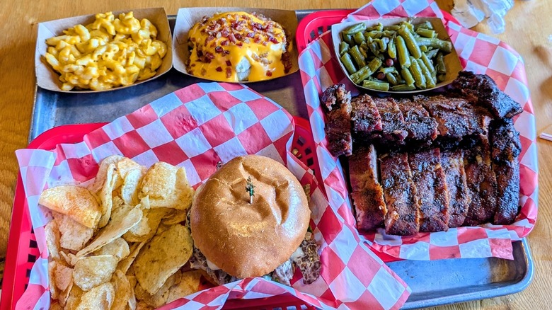 Platter of barbecue ribs, greens, burger from Bootleg Bar-B-Q