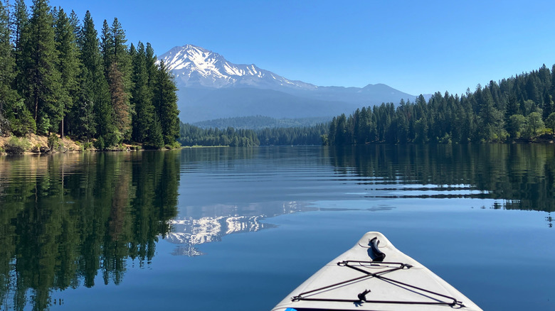 This is a picture of a kayak on peeking on Mount Shasta from Lake Siskiyou