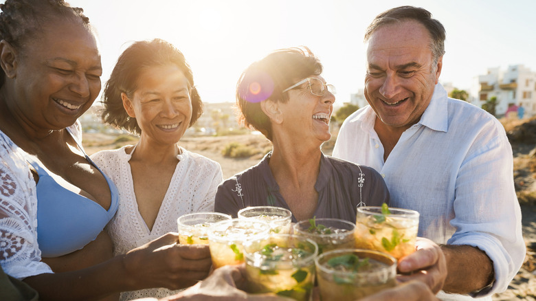 Group of older adults sharing drinks
