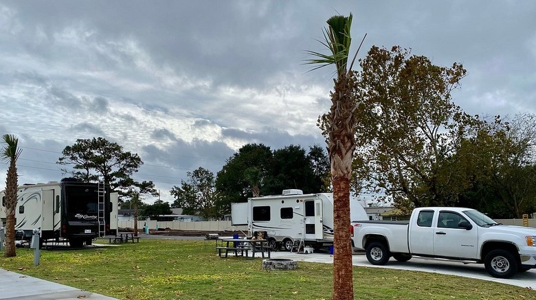 A white truck and multiple trailers at Barefoot RV Resort in North Myrtle Beach