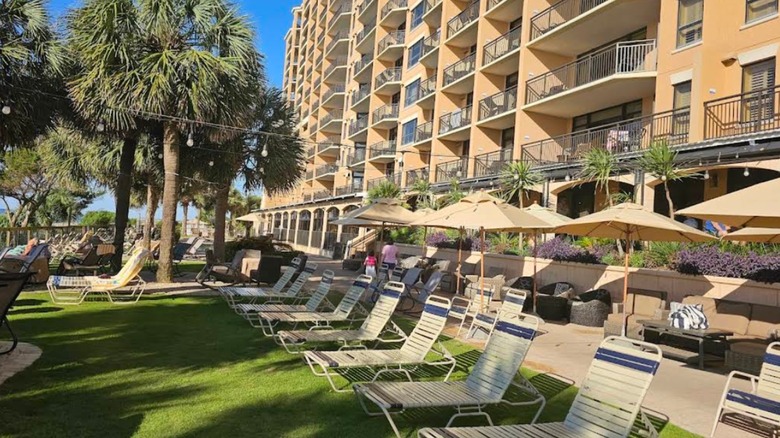 Chairs and umbrellas in front of Island Vista Resort