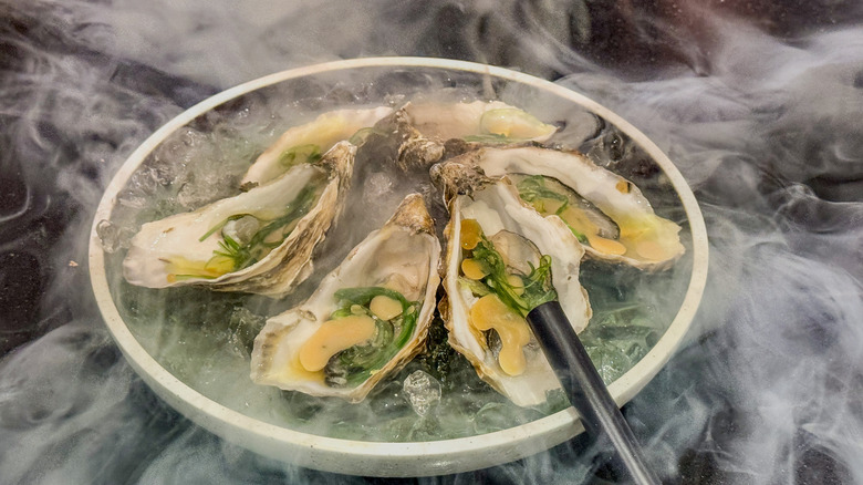 A shot of smoked oysters.