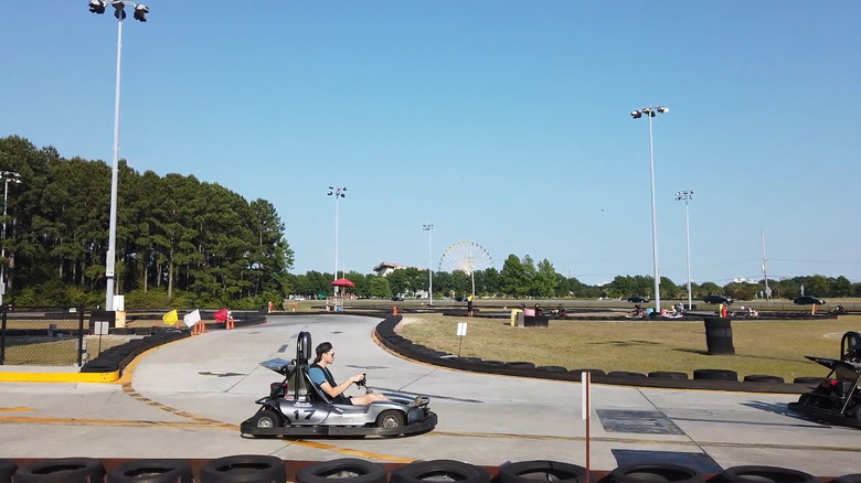 People driving go-karts at Broadway Grand Prix