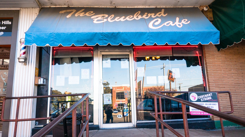 The unpretentious exterior and blue awning of the Bluebird Café in Nashville