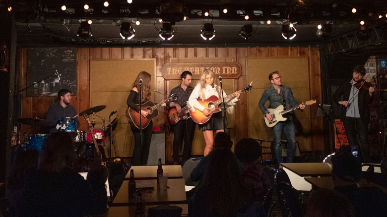 A singer takes to the stage at Nashville's Station Inn