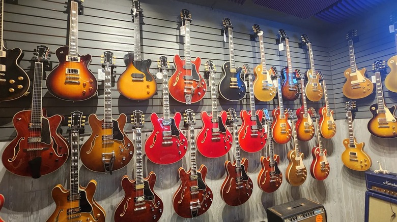 Guitars hang on the wall at Corner Music in Nashville