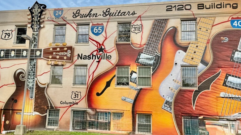 Guitar-themed mural on the exterior of Gruhn Guitars in Nashville