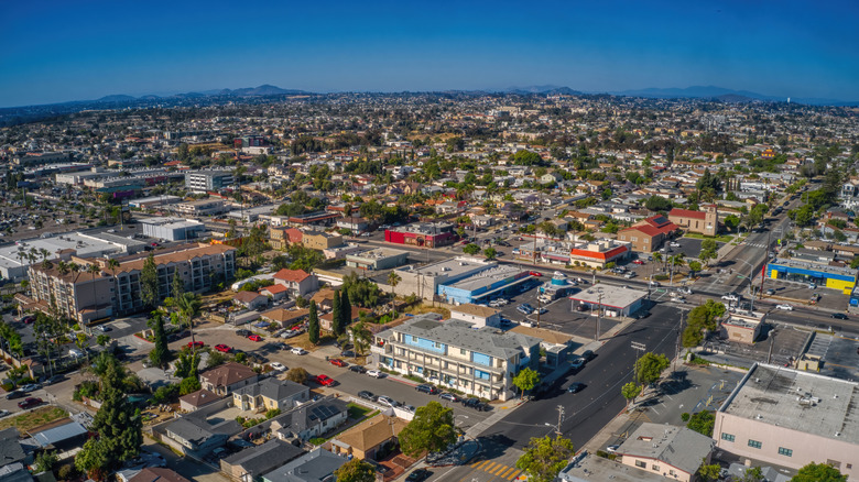 An aerial view of houses, apartments, and trees in the San Diego suburb of National City, California