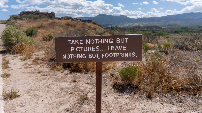 Take nothing but pictures... leave nothing but footprints. Sign at Tuzigoot National Monument reminds visitors of Leave No Trace ideology