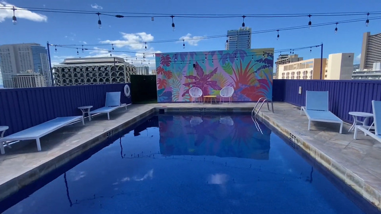 Shoreline Hotel Waikiki rooftop pool and lounge chairs.