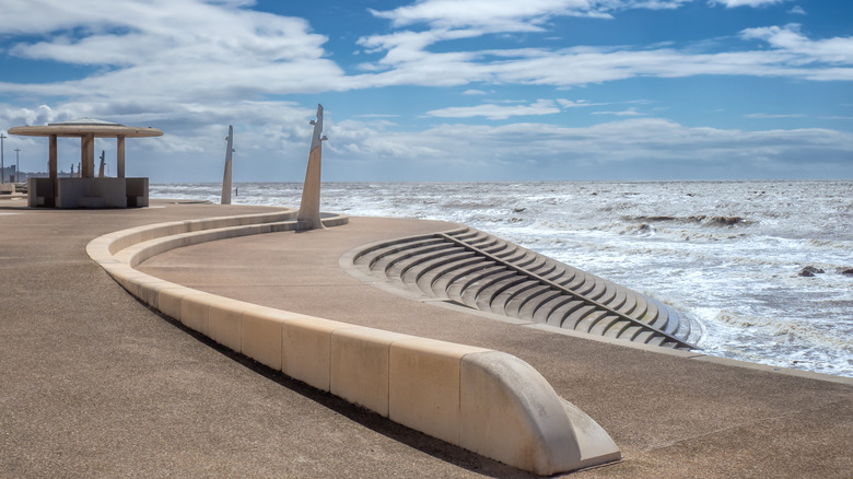 The seafront Cleveleys and its modern curved sea defenses, with steps and concrete shelter