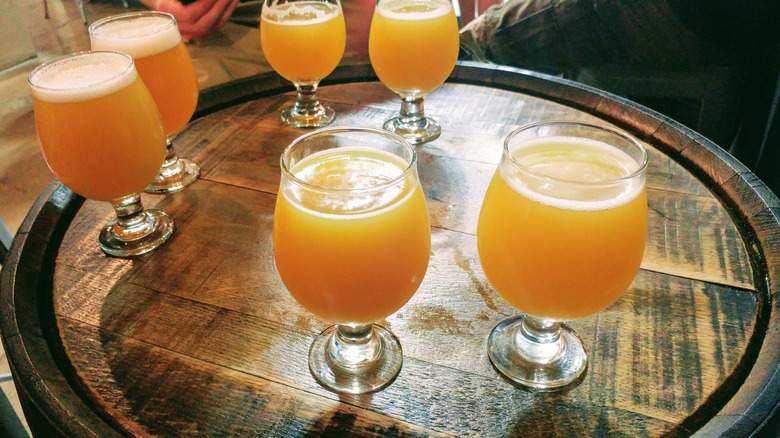 Hazy IPA's sitting on a wooden barrel at Trillium Brewery in Canton, Massachusetts