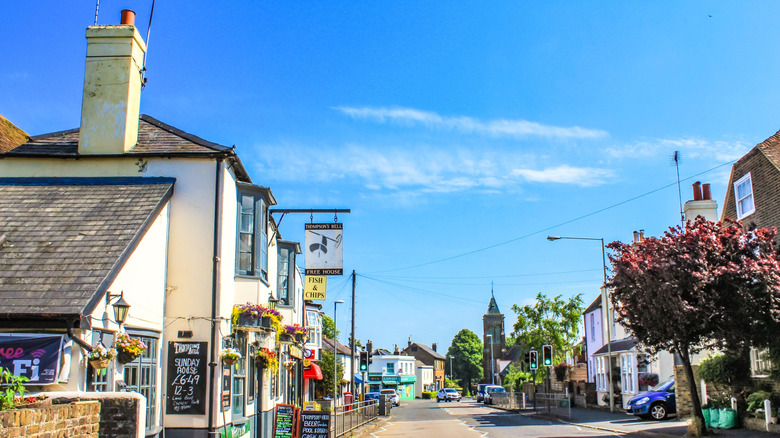 A pub, fish and chip shop, and church on a sunny day in Walmer, Kent