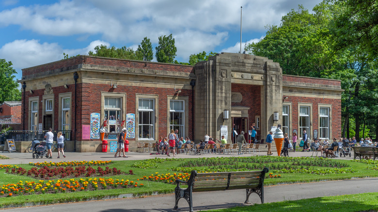 Parkgoers outside of an Art Deco Cafe in Stanley Park, England