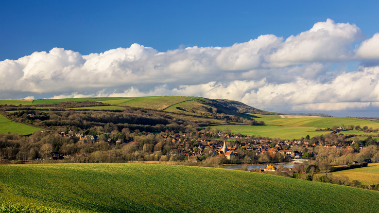 Alfriston village tucked between the hills of the South Downs National Park in England