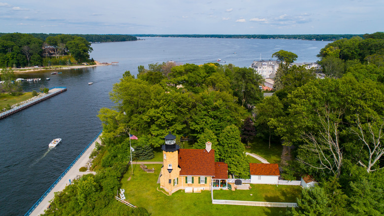 The White River Lighthouse that is between White Lake and Lake Michigan with Whitehall in the background