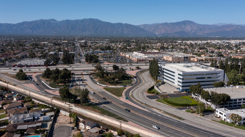 Aerial view of downtown El Monte, California, with mountains in the distance