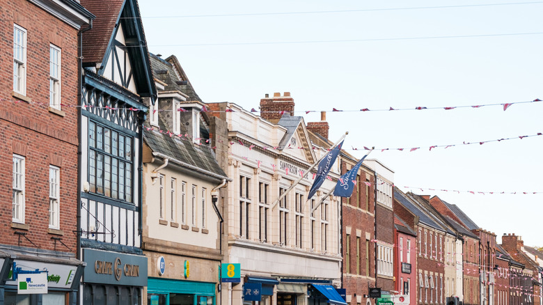 View of the commercial and residential building facades on Morpeth's Bridge Street