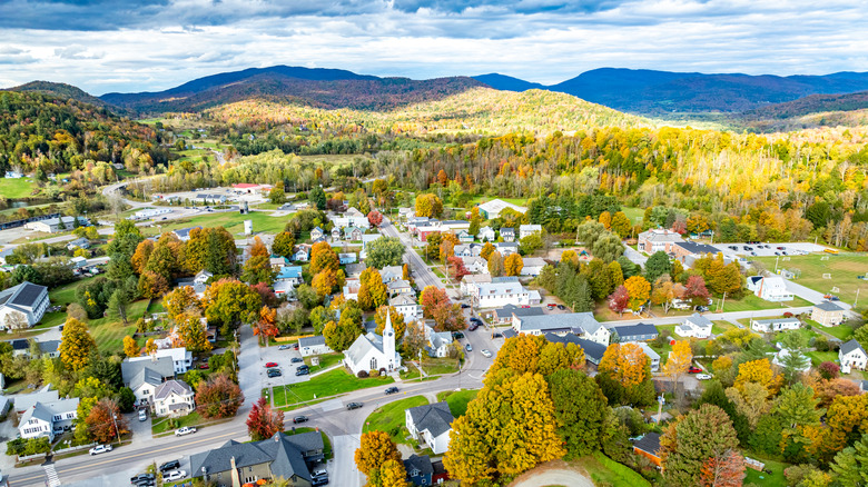 Aerial view over Cambridge, Vermont, on a partly cloudy day in fall