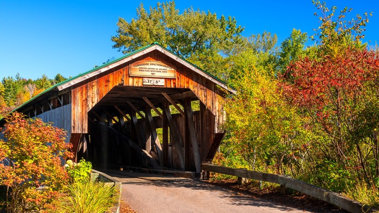 Historic Cambridge Junction Covered Bridge on a clear blue day in fall near Cambridge, Vermont