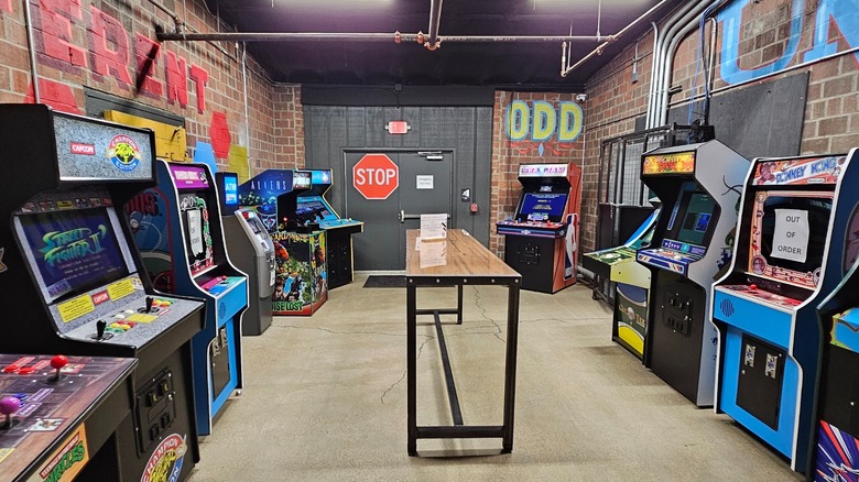 Old arcade games against brick wall in Oddfellows Ohio