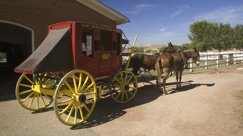 Horse drawn carriage with yellow wheels in Fort Robinson, Nebraska