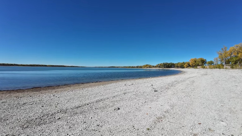 Pebbly beach along blue lake at Box Butte Reservoir