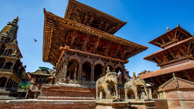 A temple and statues at Patan Durbar Square, Nepal