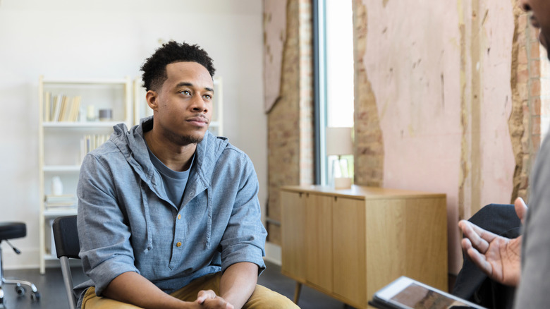 A man listening to his therapist's advice
