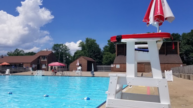 Lifeguard station with red umbrella at Neshaminy State Park Swimming Pool, Bucks County, Pennsylvania