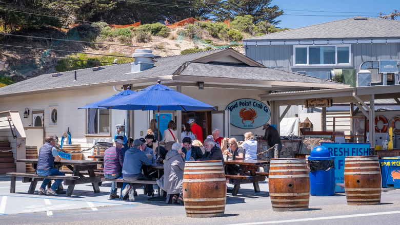 Patrons dining outside at Spud Point Crab Company, in Bodega Bay, California.