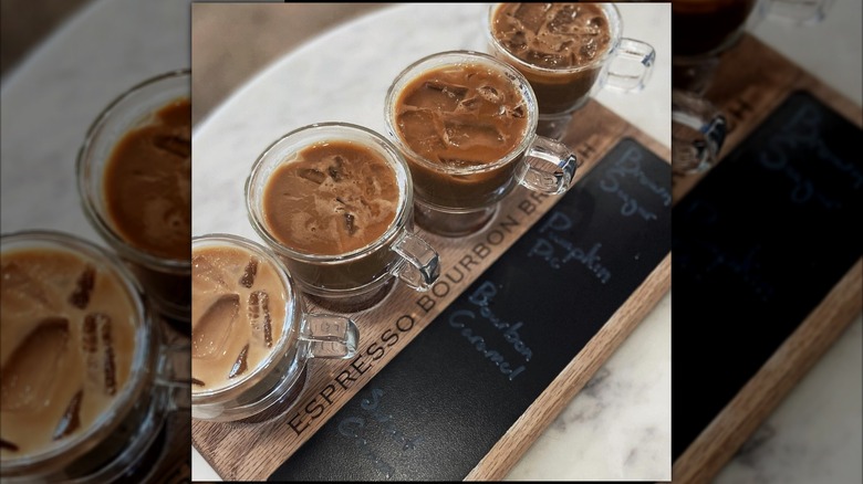 wooden tray with four coffees