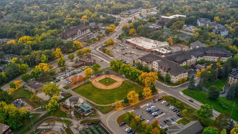 City buildings, baseball field, and trees