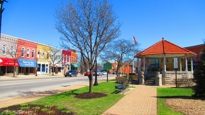 Colorful, old-fashioned bulidings next to a small park with a gazebo