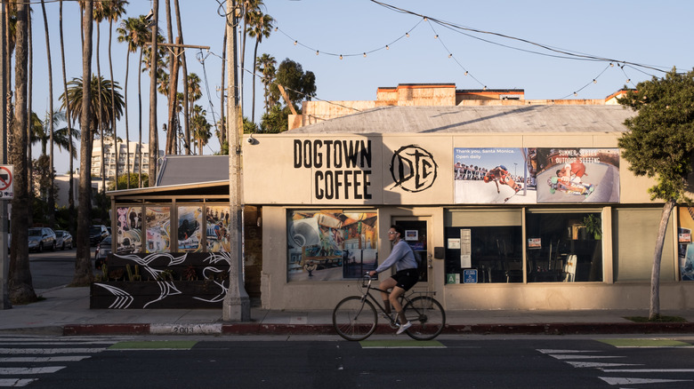A bicyclist peddling past Dogtown Coffee on Main Street in Santa Monica