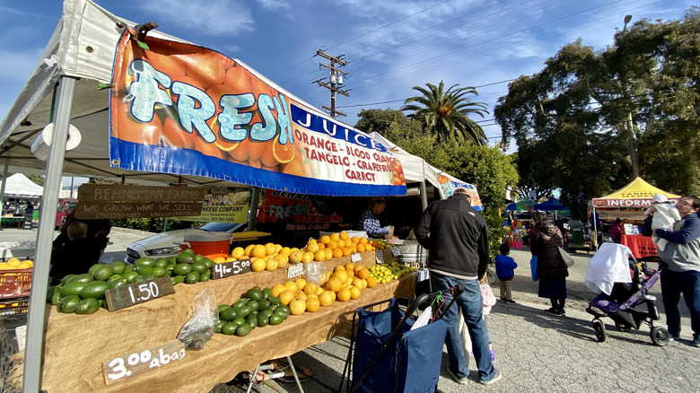 A vendor sells fresh citrus fruits at the Sunday farmer's market on Main Street in Santa Monica