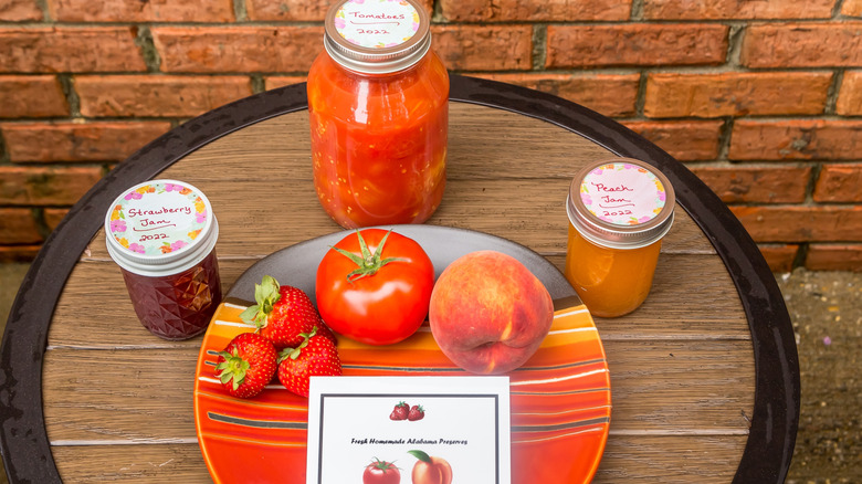 Assortment of homemade tomato, strawberry, and peach preserves from a local farmer in Clanton, Alabama