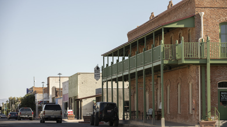 street lined with historic buildings and vehicles