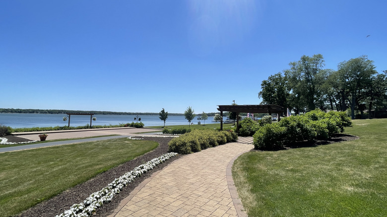 lakefront walking path with trees