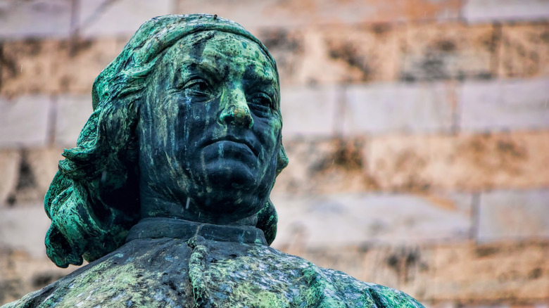 Head of a worn stone statue of Pietro Perugino