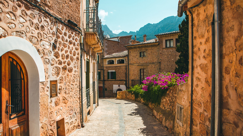 Narrow street between stone buildings