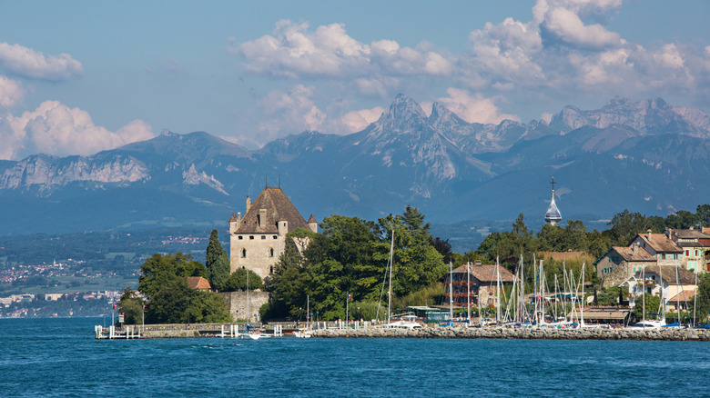 A view of Yvoire, France, showing a medieval building and port