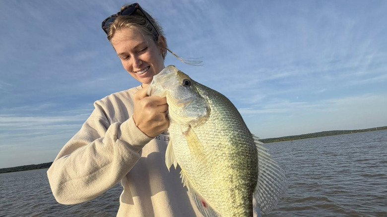 Woman holding a crappie at Grenada Lake, Mississippi