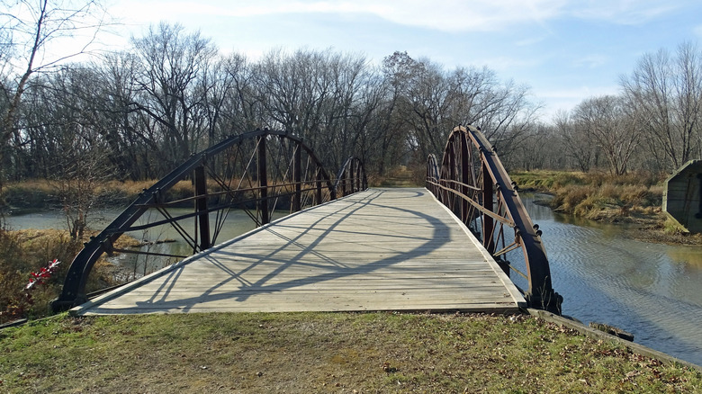 Pedestrianized steel bridge over water on the McGilvray Seven Bridges Trail
