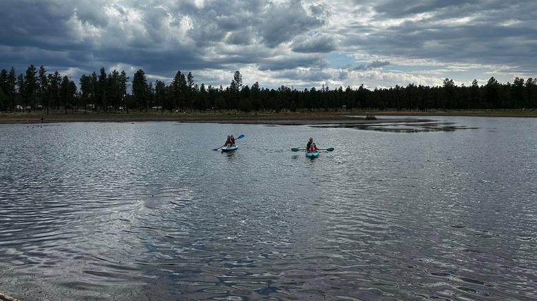 Kayakers on Woodland Lake on a cloudy day